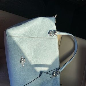 Powder blue Coach purse.